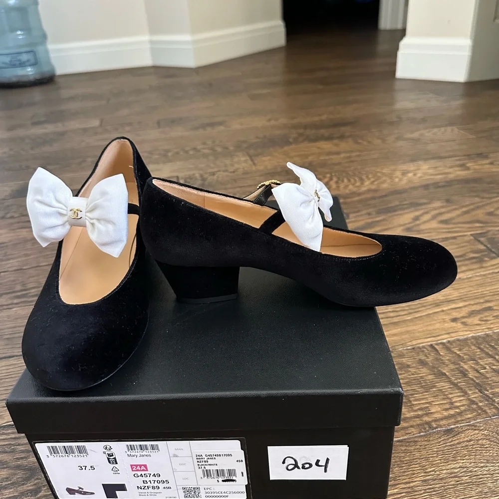 CHANEL Black velvet Mary Jane’s with White Bow